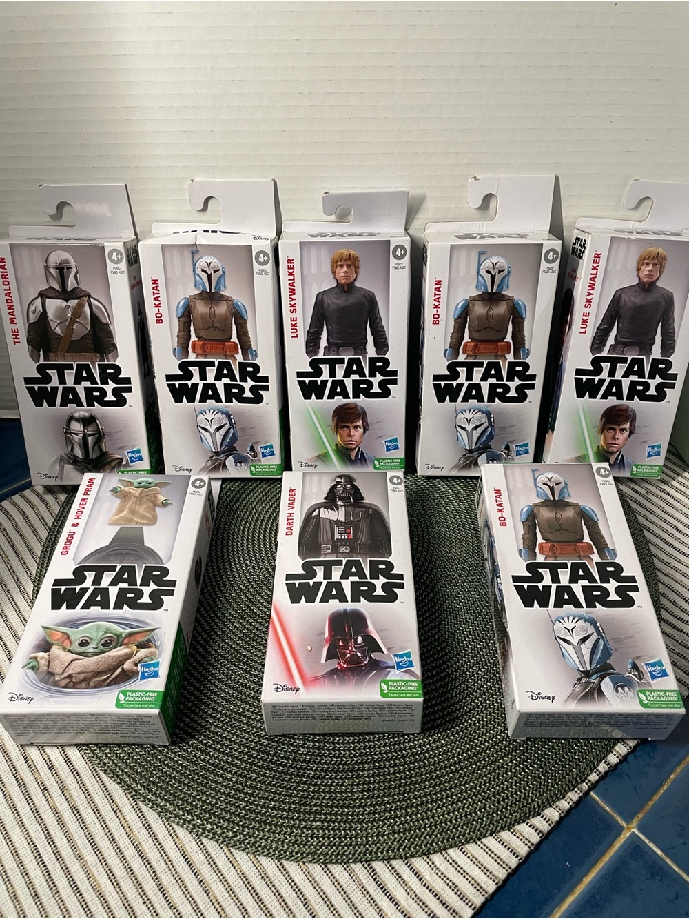 8 boxes of Star Wars Figures in White Packaging with Green Accents, ( brand new)